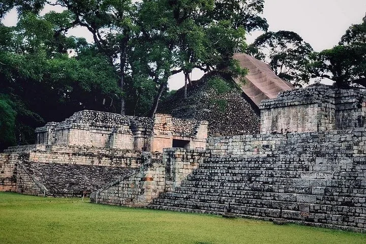 Stone steps leading up to ancient Mayan structures at Copan Ruins